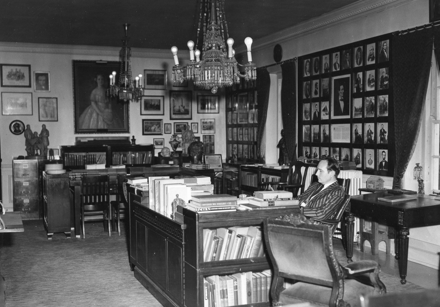 Wayne C. Temple sitting at a desk in the Lincoln Room at Lincoln Memorial University on June 2, 1958.
